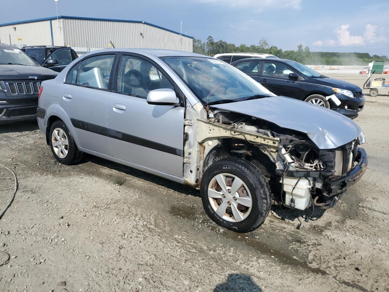 2009 Kia Rio Base VIN: KNADE223096573574 Lot: 63005154