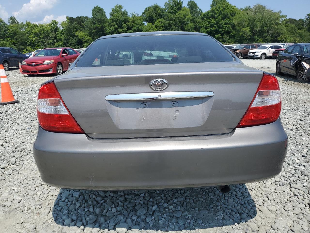 2003 Toyota Camry Le VIN: 4T1BF32K43U566999 Lot: 65321394