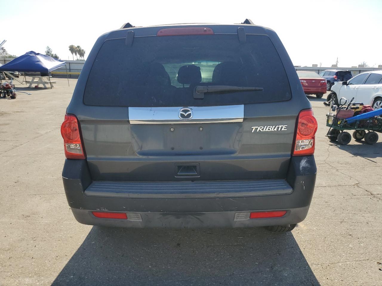 2010 Mazda Tribute I VIN: 4F2CY0C78AKM04670 Lot: 63527224