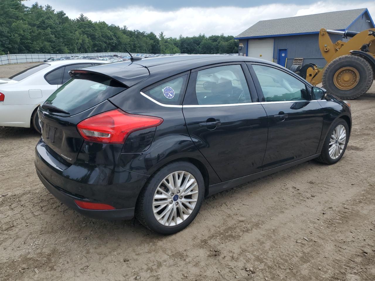 2017 Ford Focus Titanium VIN: 1FADP3N24HL200713 Lot: 64478374