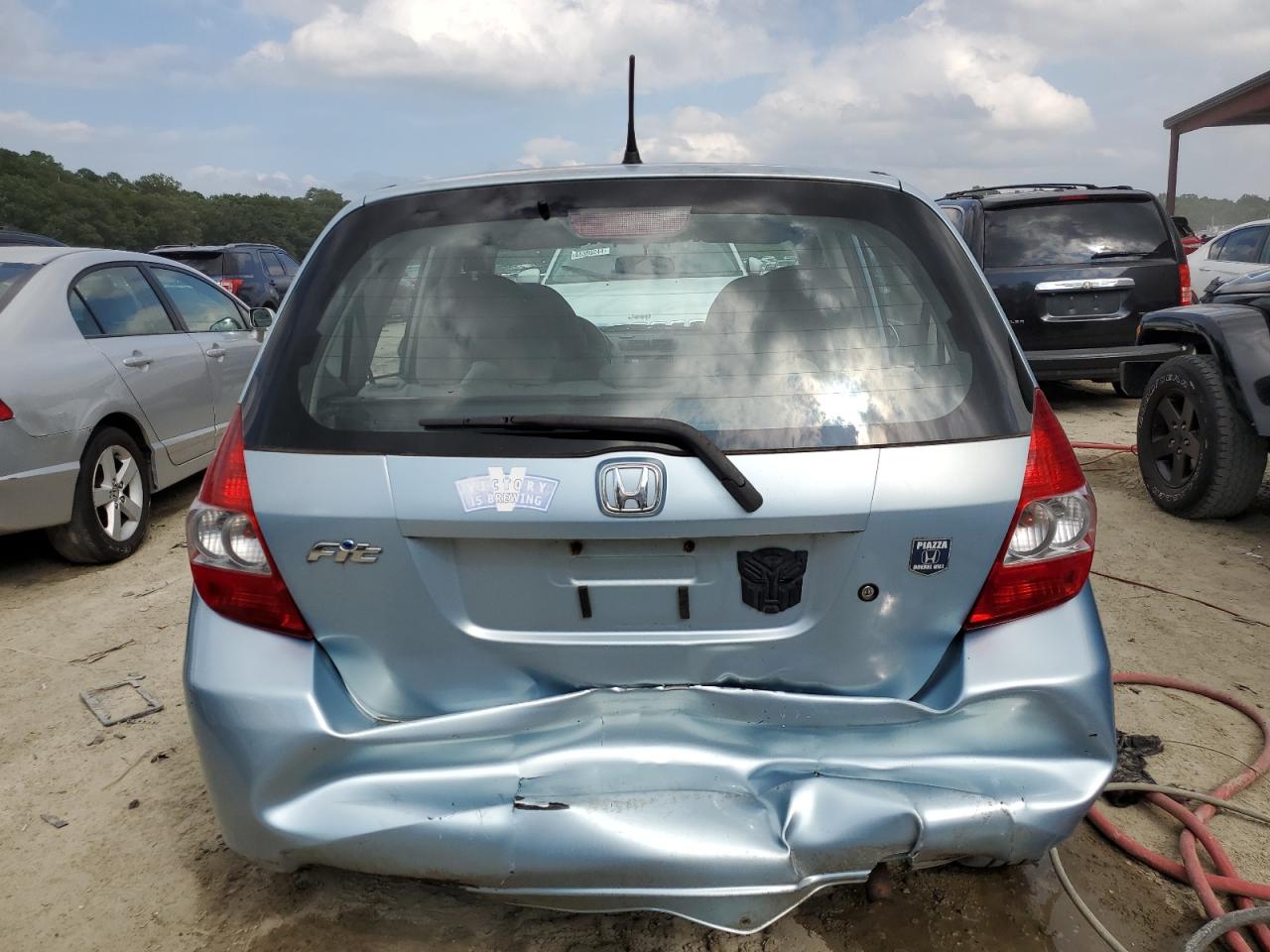 2007 Honda Fit VIN: JHMGD38447S058699 Lot: 64365974