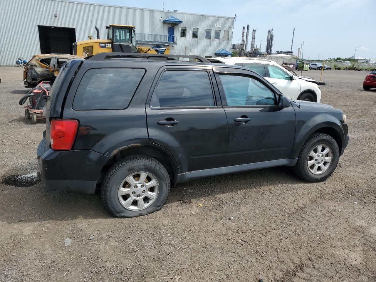 2011 Mazda Tribute I VIN: 4F2CY0C74BKM05106 Lot: 64842864