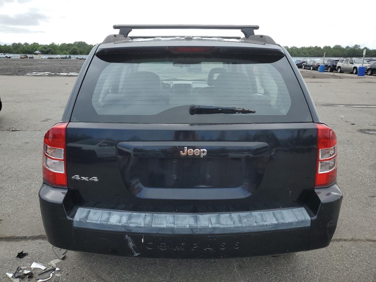 2007 Jeep Compass VIN: 1J8FF47W97D385418 Lot: 63118064