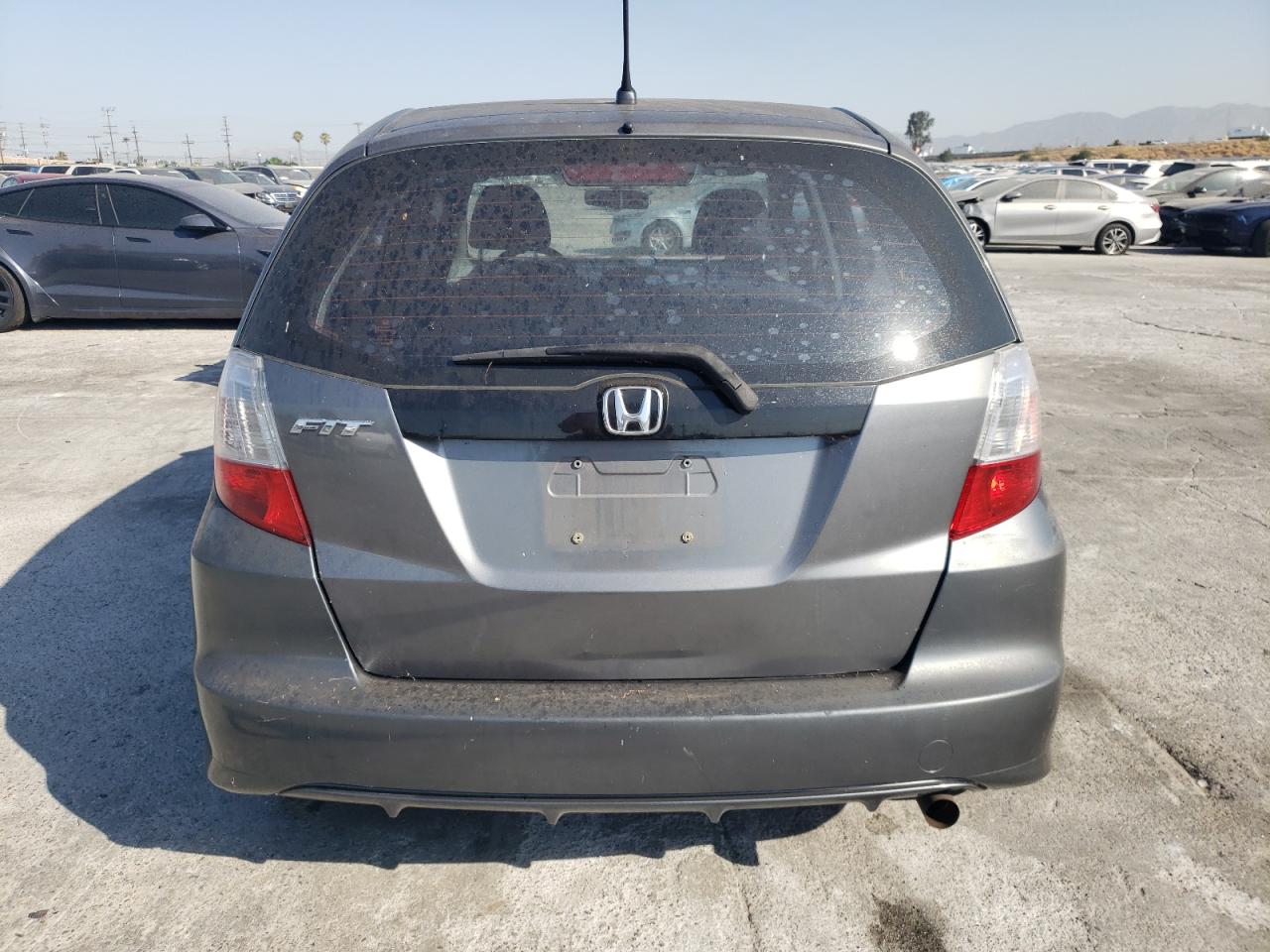 2011 Honda Fit VIN: JHMGE8H30BS002656 Lot: 64466554