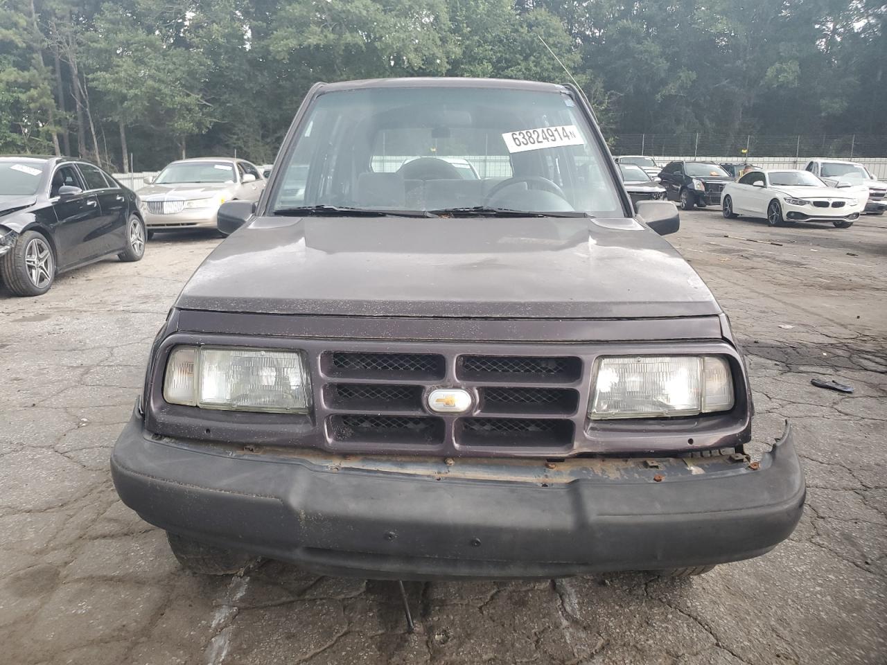 1998 Chevrolet Tracker VIN: 2CNBE1367W6919926 Lot: 63824914