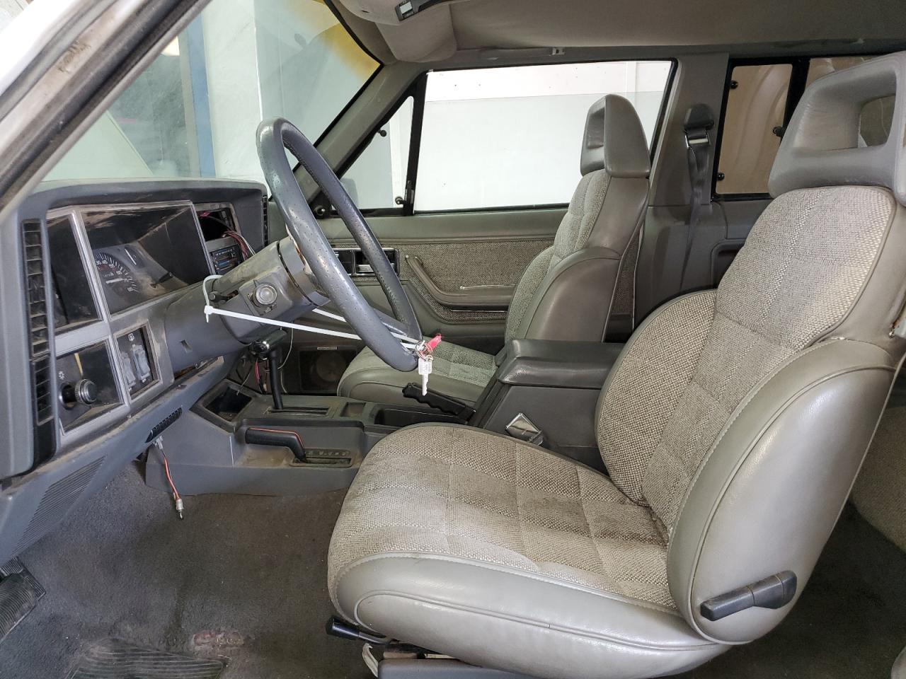 1990 Jeep Cherokee Laredo VIN: 1J4FJ57L1LL166898 Lot: 60490274