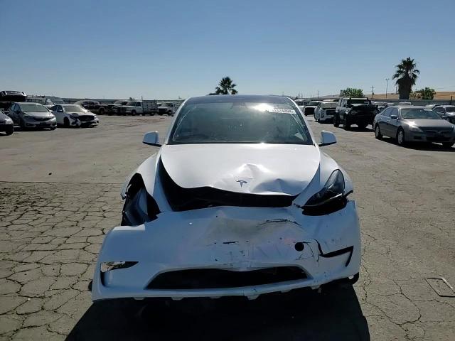 2023 Tesla Model Y VIN: 7SAYGAEE3PF701588 Lot: 63324094