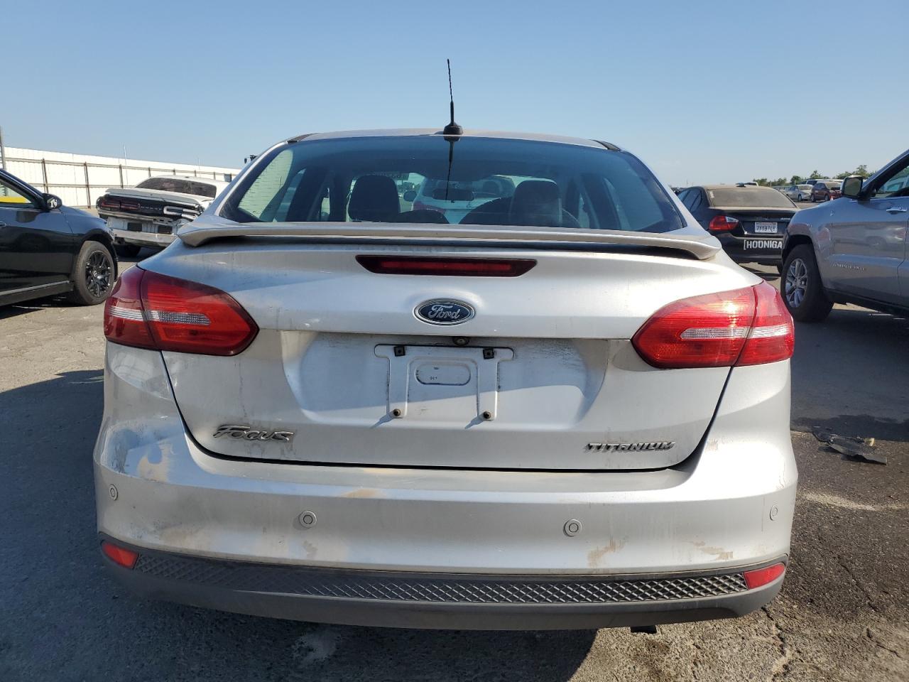 2015 Ford Focus Titanium VIN: 1FADP3J29FL269772 Lot: 63290225