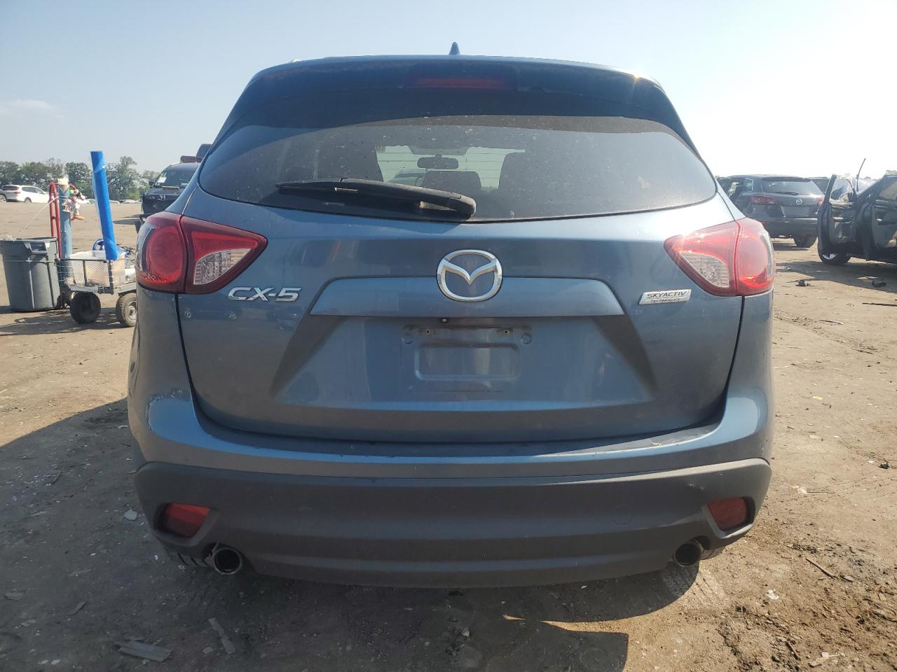 2014 Mazda Cx-5 Touring VIN: JM3KE2CY3E0415299 Lot: 63901935