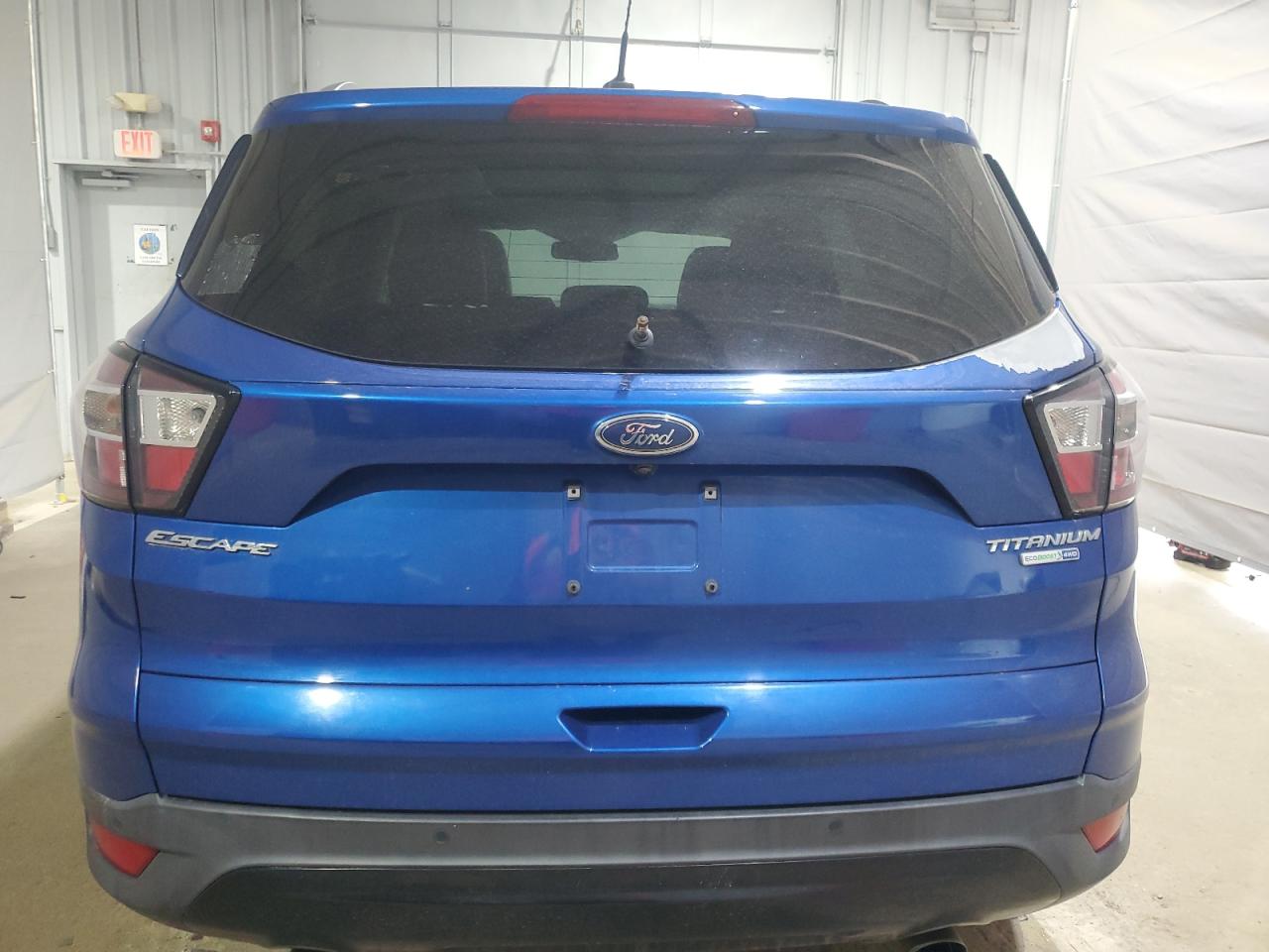 2017 Ford Escape Titanium VIN: 1FMCU9J97HUB71055 Lot: 64975605