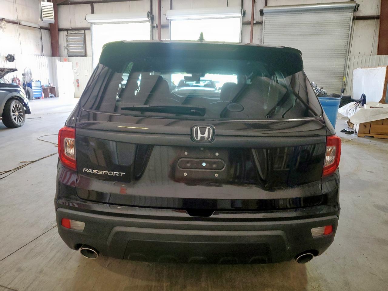 2021 Honda Passport Exl VIN: 5FNYF7H52MB000129 Lot: 63862435