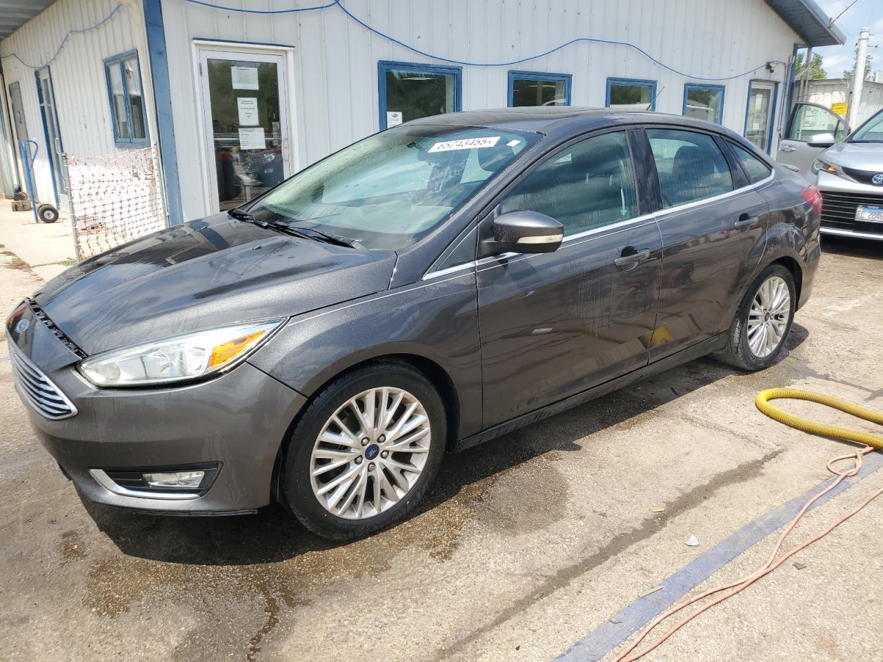 2015 Ford Focus Titanium VIN: 1FADP3J29FL293280 Lot: 65243455