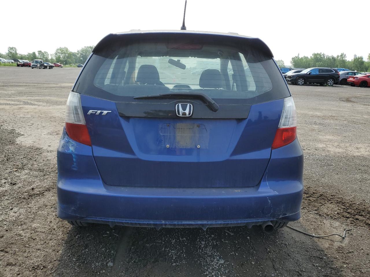2010 Honda Fit Lx VIN: JHMGE8H58AC803037 Lot: 64092015