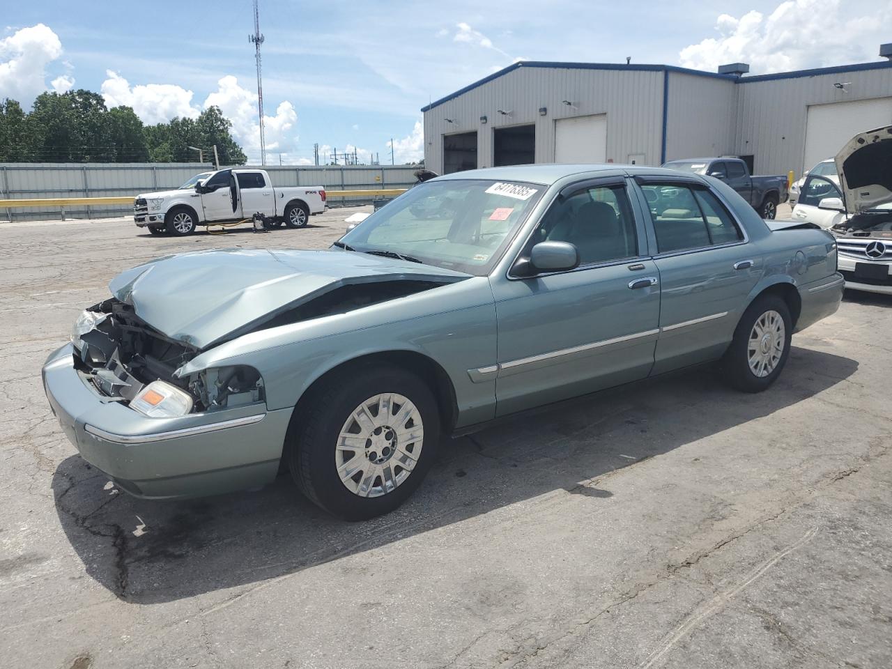 2006 Mercury Grand Marquis Gs VIN: 2MEFM74V16X613542 Lot: 64176385