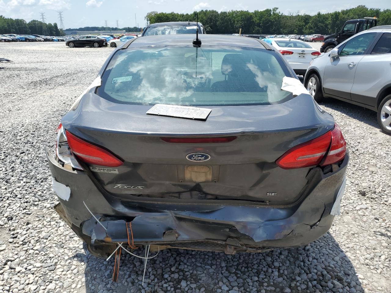 2018 Ford Focus Se VIN: 1FADP3F24JL315588 Lot: 65410525