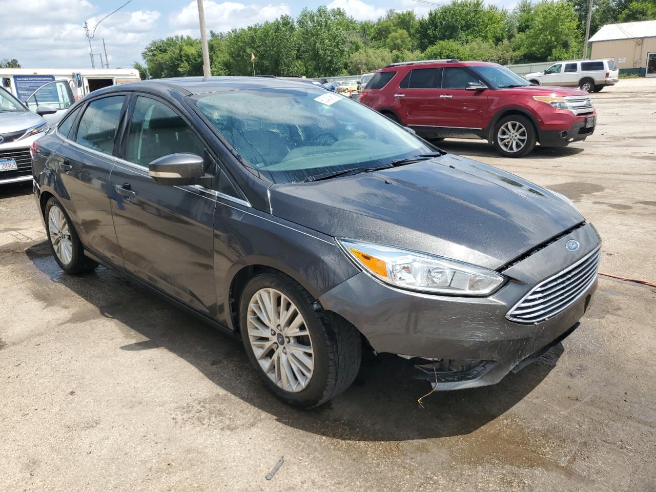 2015 Ford Focus Titanium VIN: 1FADP3J29FL293280 Lot: 65243455