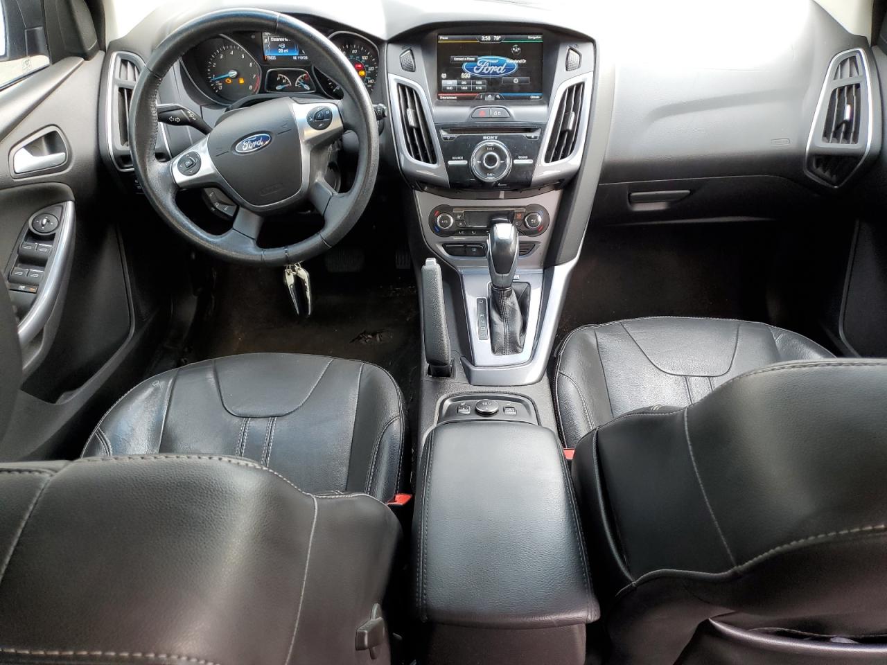 2014 Ford Focus Titanium VIN: 1FADP3N2XEL440389 Lot: 65415355