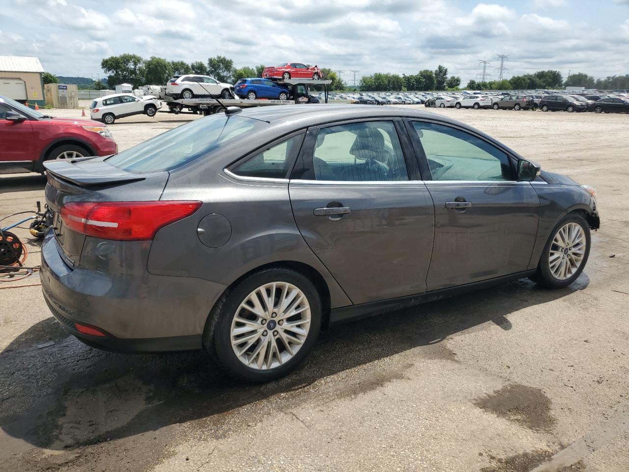 2015 Ford Focus Titanium VIN: 1FADP3J29FL293280 Lot: 65243455