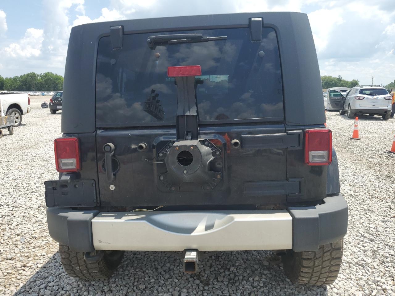 2010 Jeep Wrangler Unlimited Sahara VIN: 1J4BA5H17AL214834 Lot: 63819885
