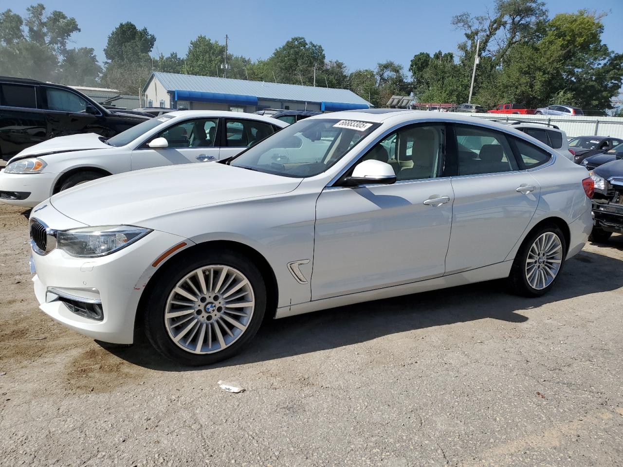 2015 BMW 335 Xigt white hatchback gas WBA3X9C56FD868927 photo #1