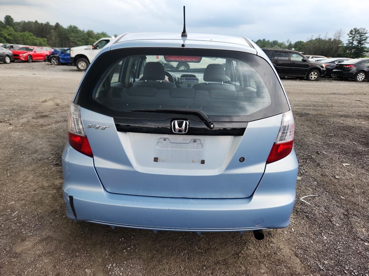 2010 Honda Fit VIN: JHMGE8H23AC010556 Lot: 64293725