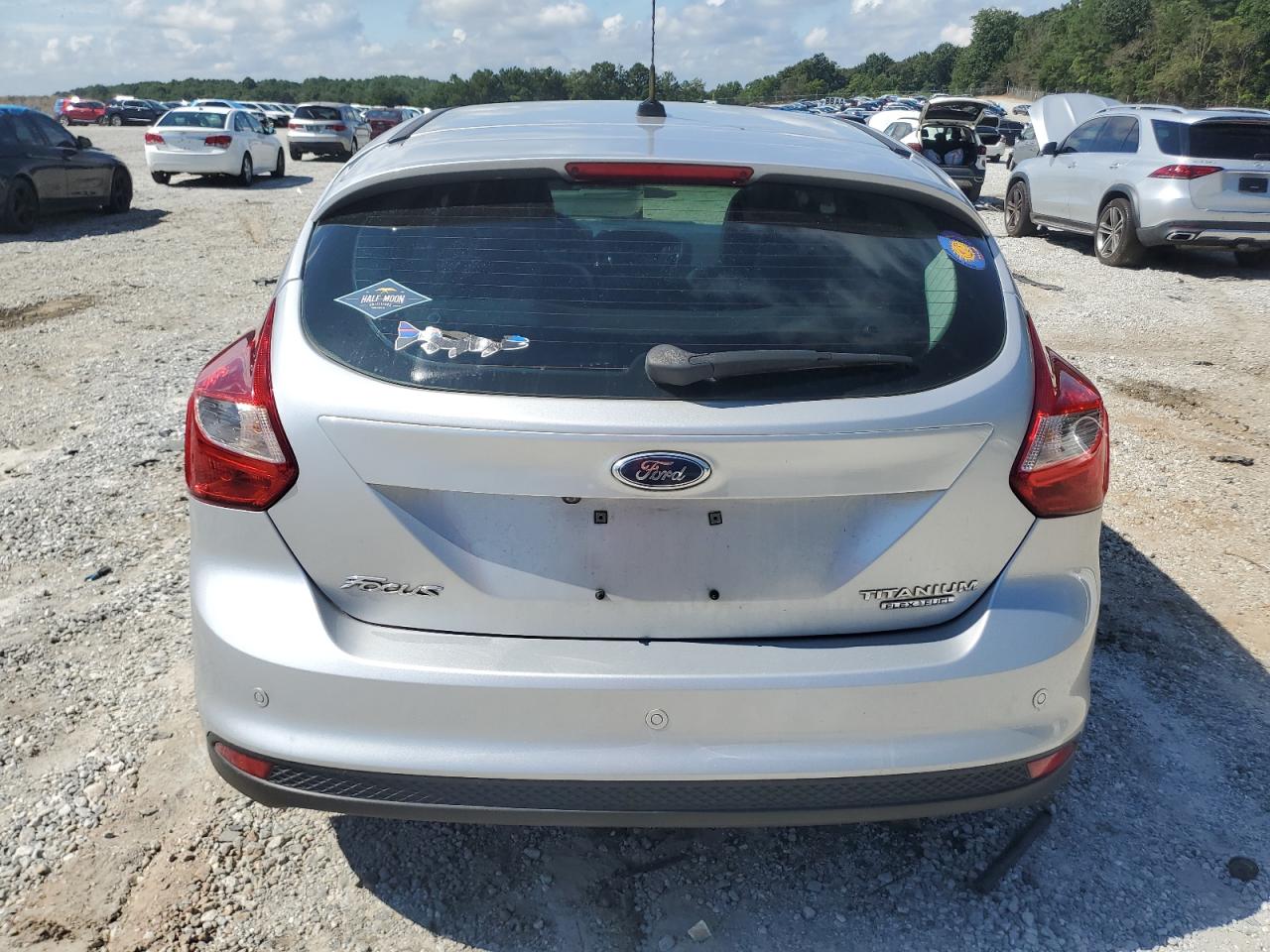 2014 Ford Focus Titanium VIN: 1FADP3N27EL409889 Lot: 63164225