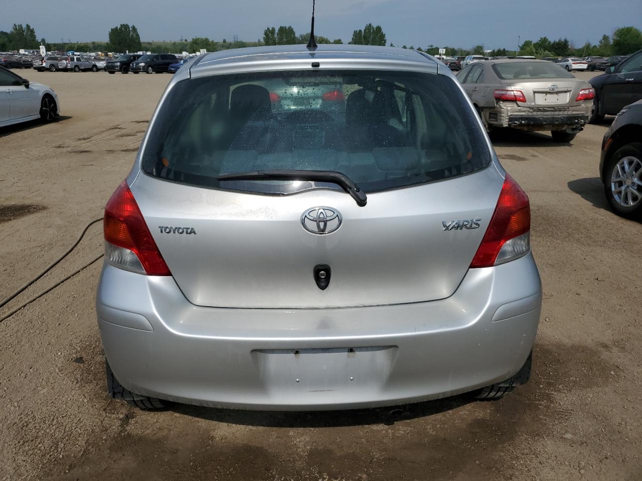 2010 Toyota Yaris VIN: JTDKT4K30A5321930 Lot: 63844015