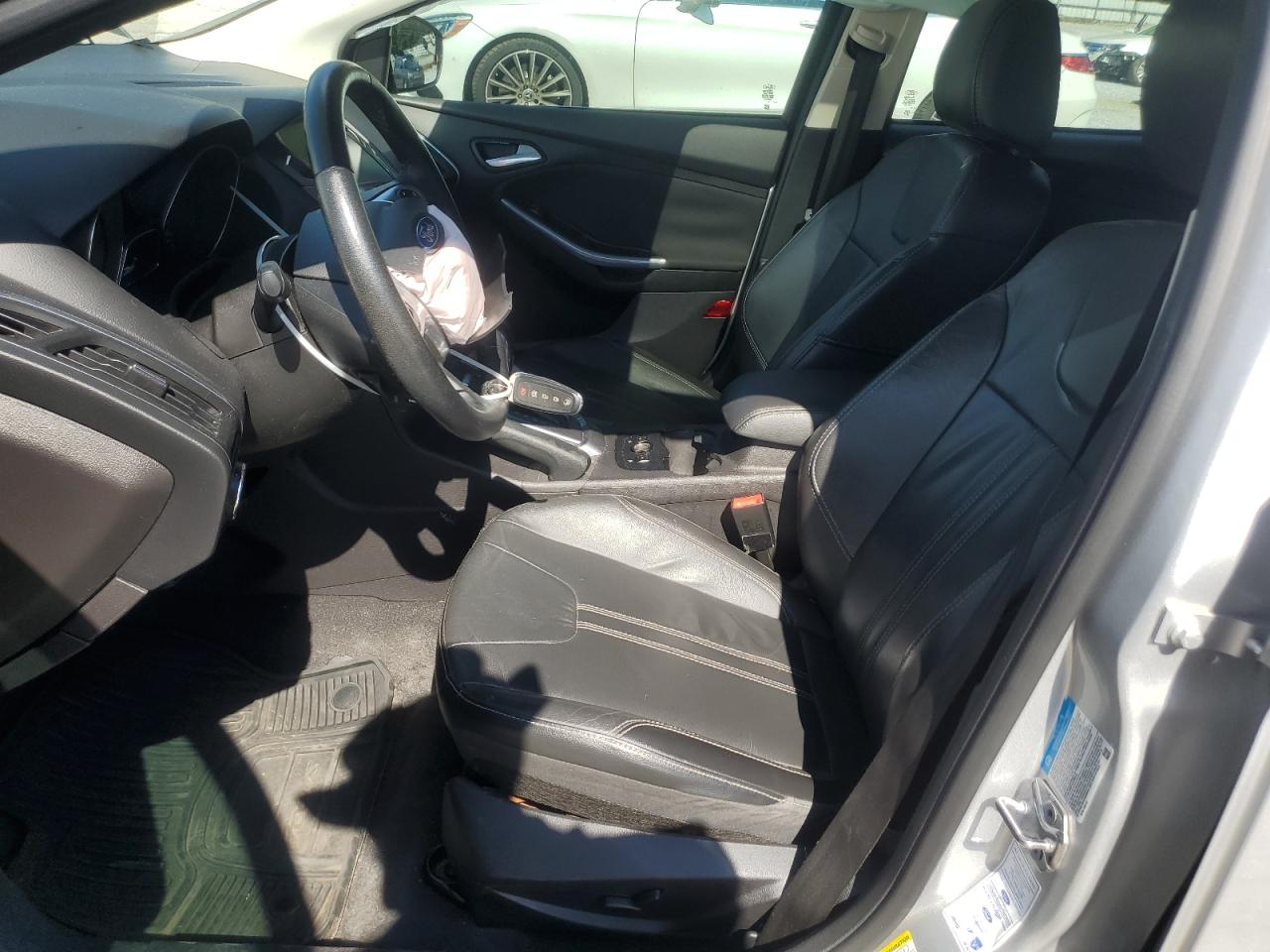 2014 Ford Focus Titanium VIN: 1FADP3N27EL409889 Lot: 63164225
