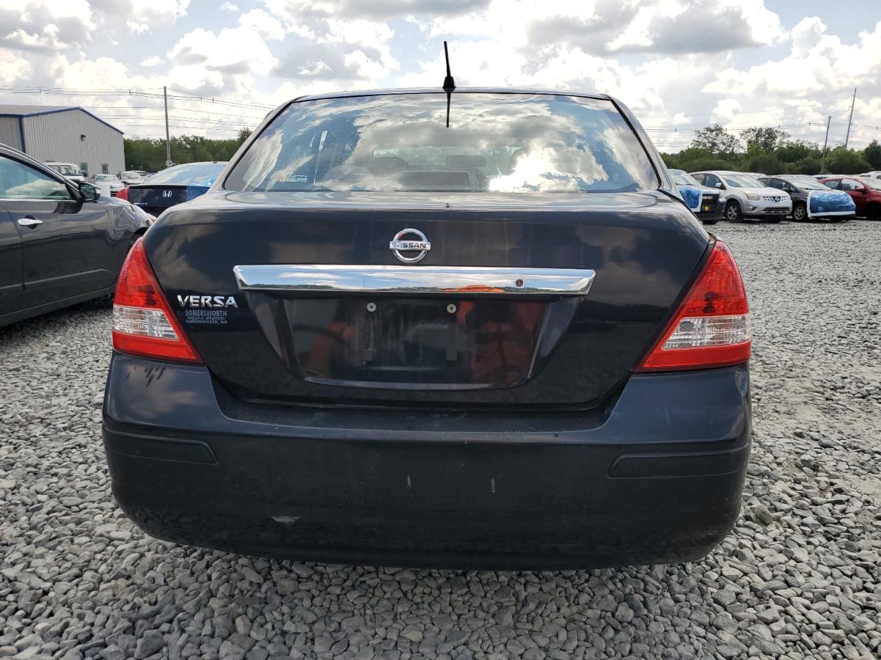 2009 Nissan Versa S VIN: 3N1BC11E79L445869 Lot: 63742355