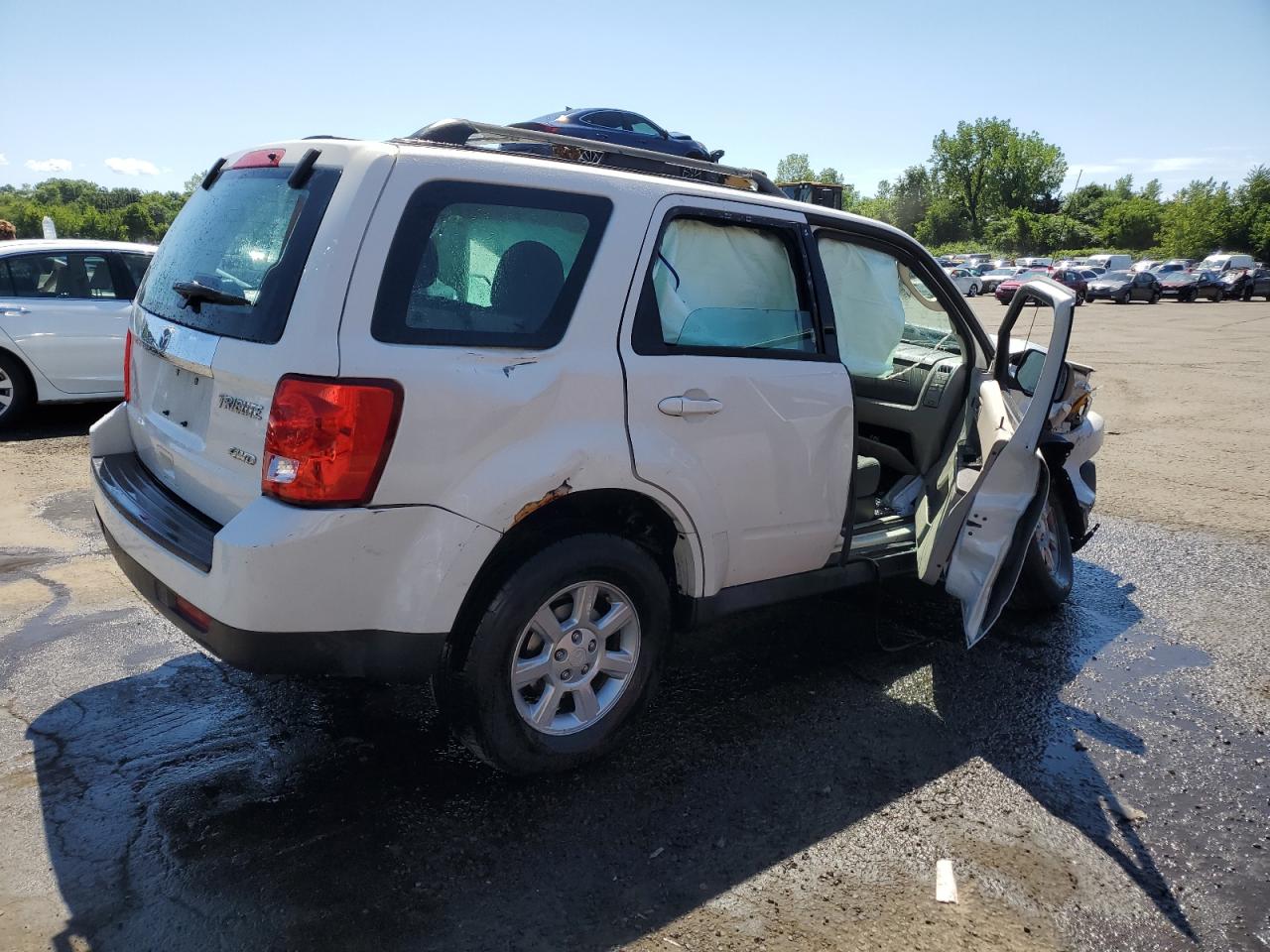 2010 Mazda Tribute I VIN: 4F2CY9C71AKM04921 Lot: 65505725