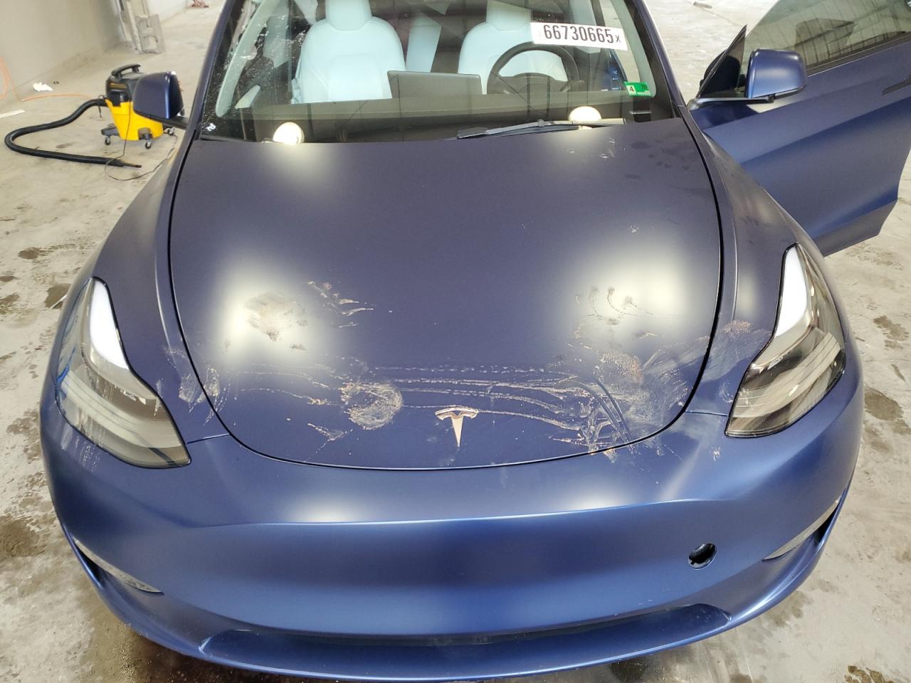 2023 Tesla Model Y VIN: 7SAYGAEE7PF697030 Lot: 66730665