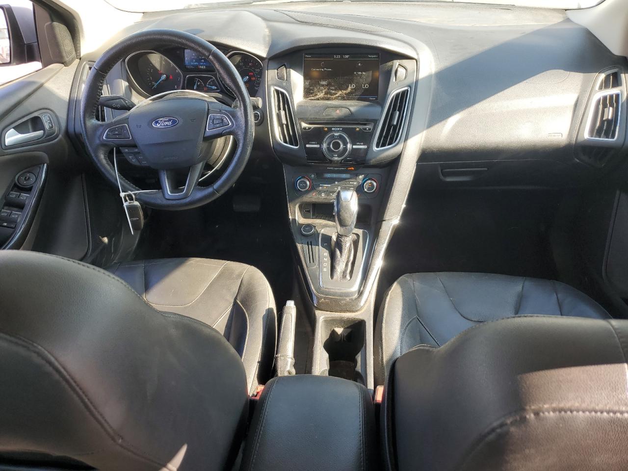 2015 Ford Focus Titanium VIN: 1FADP3J29FL269772 Lot: 63290225