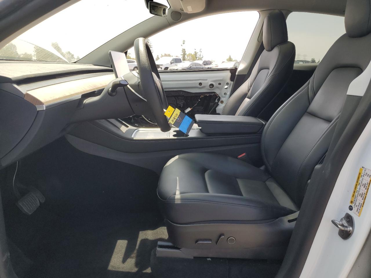 2023 Tesla Model Y VIN: 7SAYGAEE9PF599715 Lot: 65394255