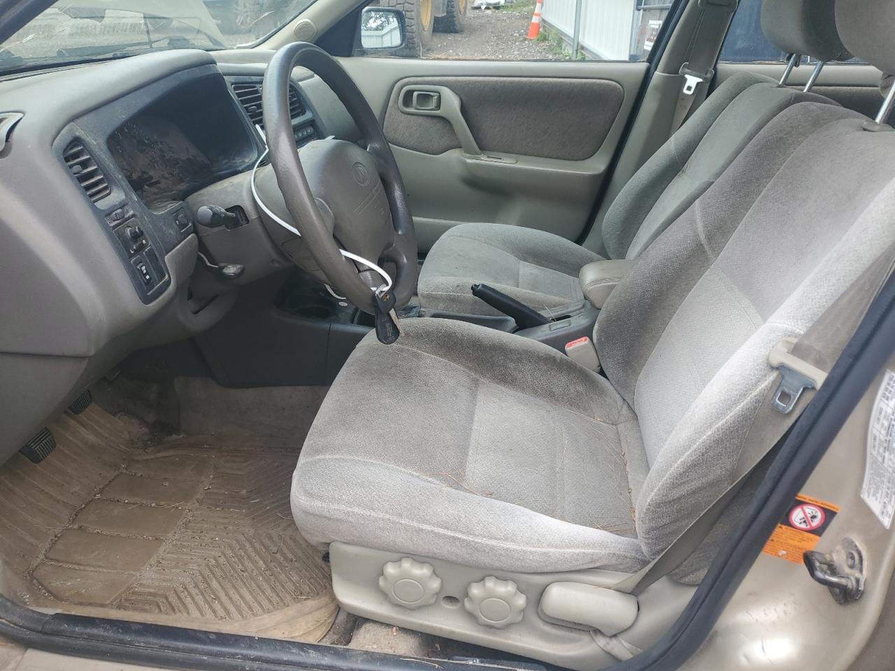 1999 Infiniti G20 VIN: JNKCP11A0XT009374 Lot: 63001565