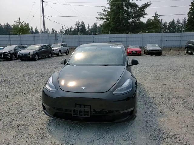 2023 Tesla Model Y VIN: 7SAYGAEE6PF874750 Lot: 65799844