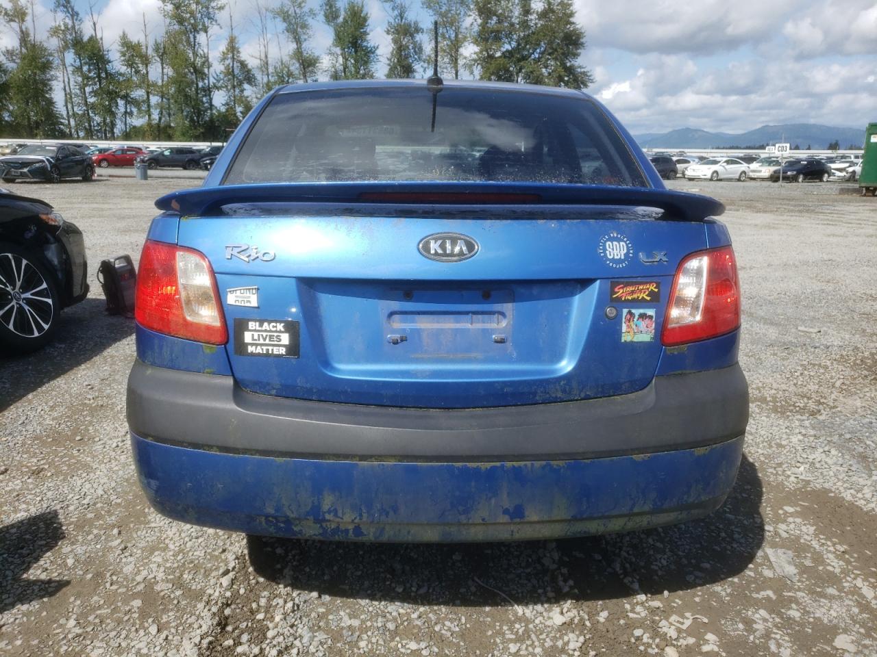 2009 Kia Rio Base VIN: KNADE223496571973 Lot: 68531154
