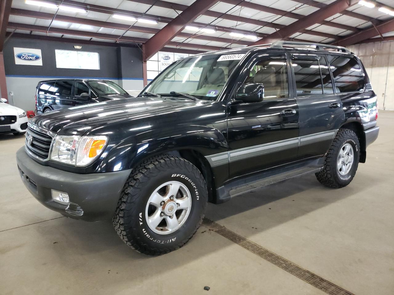 1999 Toyota Land Cruiser VIN: JT3HT05J2X0064180 Lot: 66560574