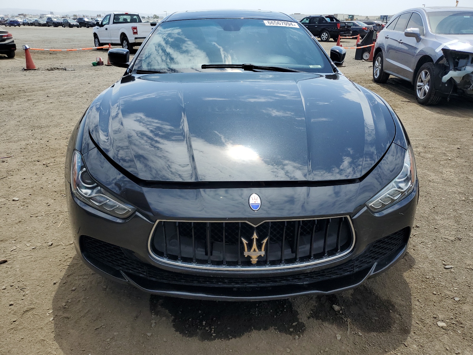 2014 Maserati Ghibli vin: ZAM57XSA5E1090243