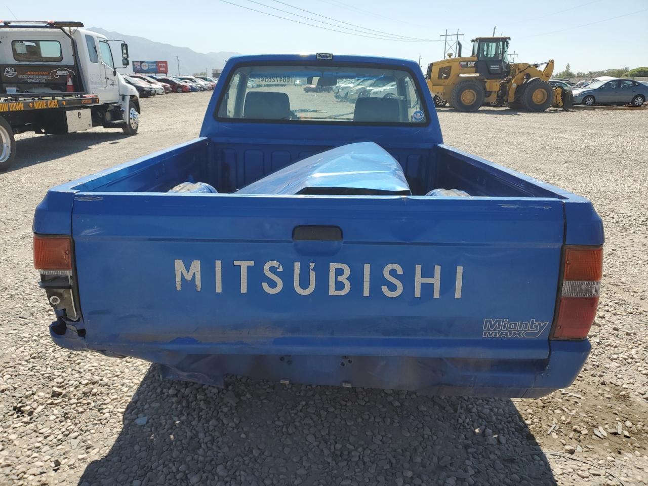 1991 Mitsubishi Mighty Max / S VIN: JA7FL24W5MP030326 Lot: 68472654