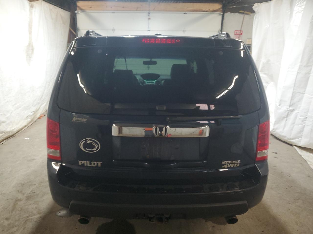 2010 Honda Pilot Touring VIN: 5FNYF4H81AB039377 Lot: 68305794