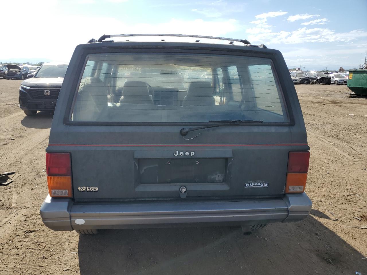 1991 Jeep Cherokee Laredo VIN: 1J4FJ58S4ML592642 Lot: 69472814