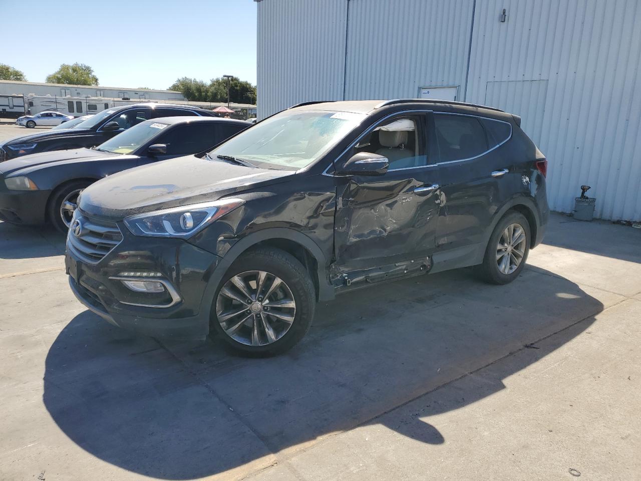 5NMZU4LA5HH040237 2017 HYUNDAI SANTA FE - Image 1