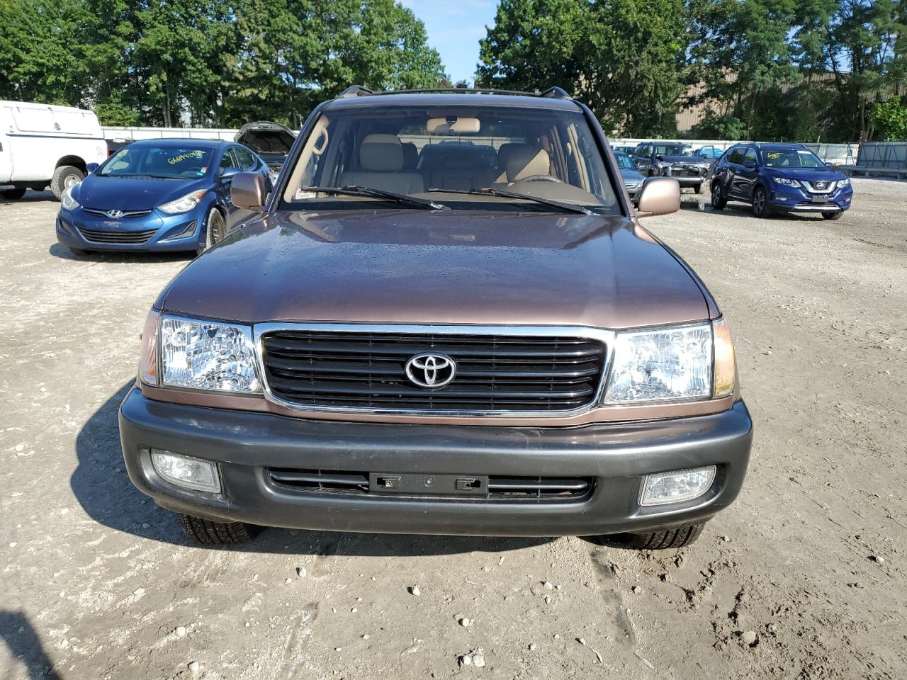 1999 Toyota Land Cruiser VIN: JT3HT05J3X0040065 Lot: 66630954