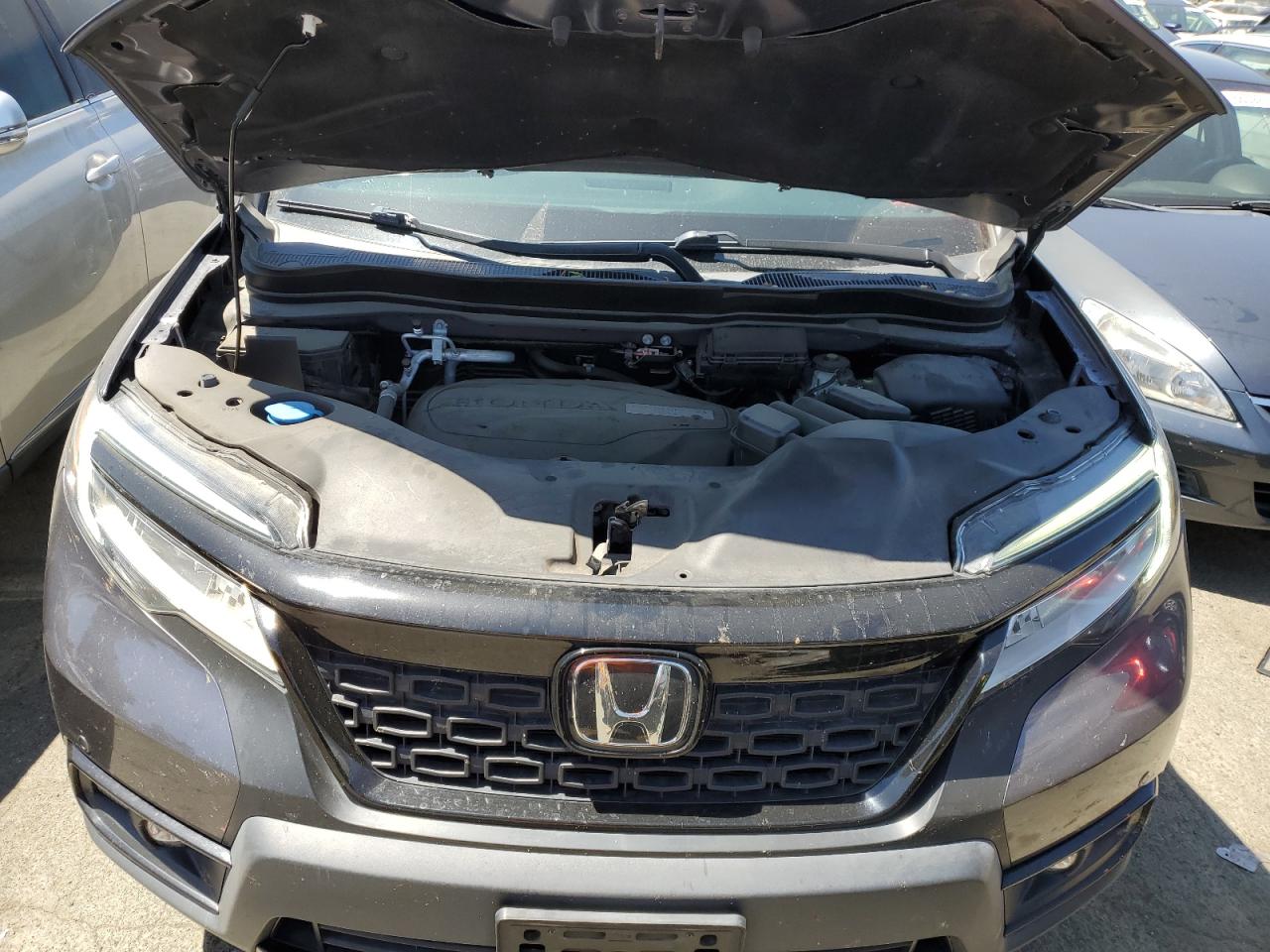 2019 Honda Passport Elite VIN: 5FNYF8H01KB015356 Lot: 65678624