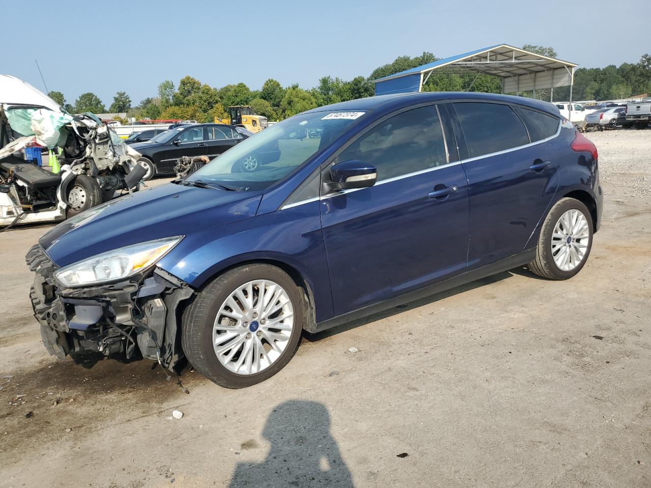 2017 Ford Focus Titanium VIN: 1FADP3N24HL212991 Lot: 67467374