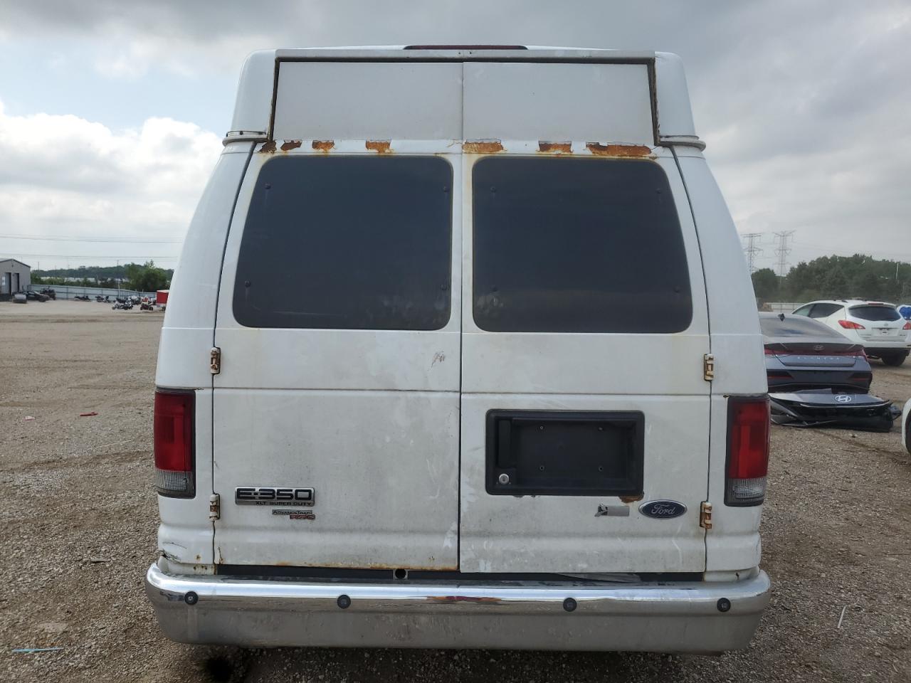 2009 Ford Econoline E350 Super Duty Wagon VIN: 1FBNE31L09DA79214 Lot: 68339545