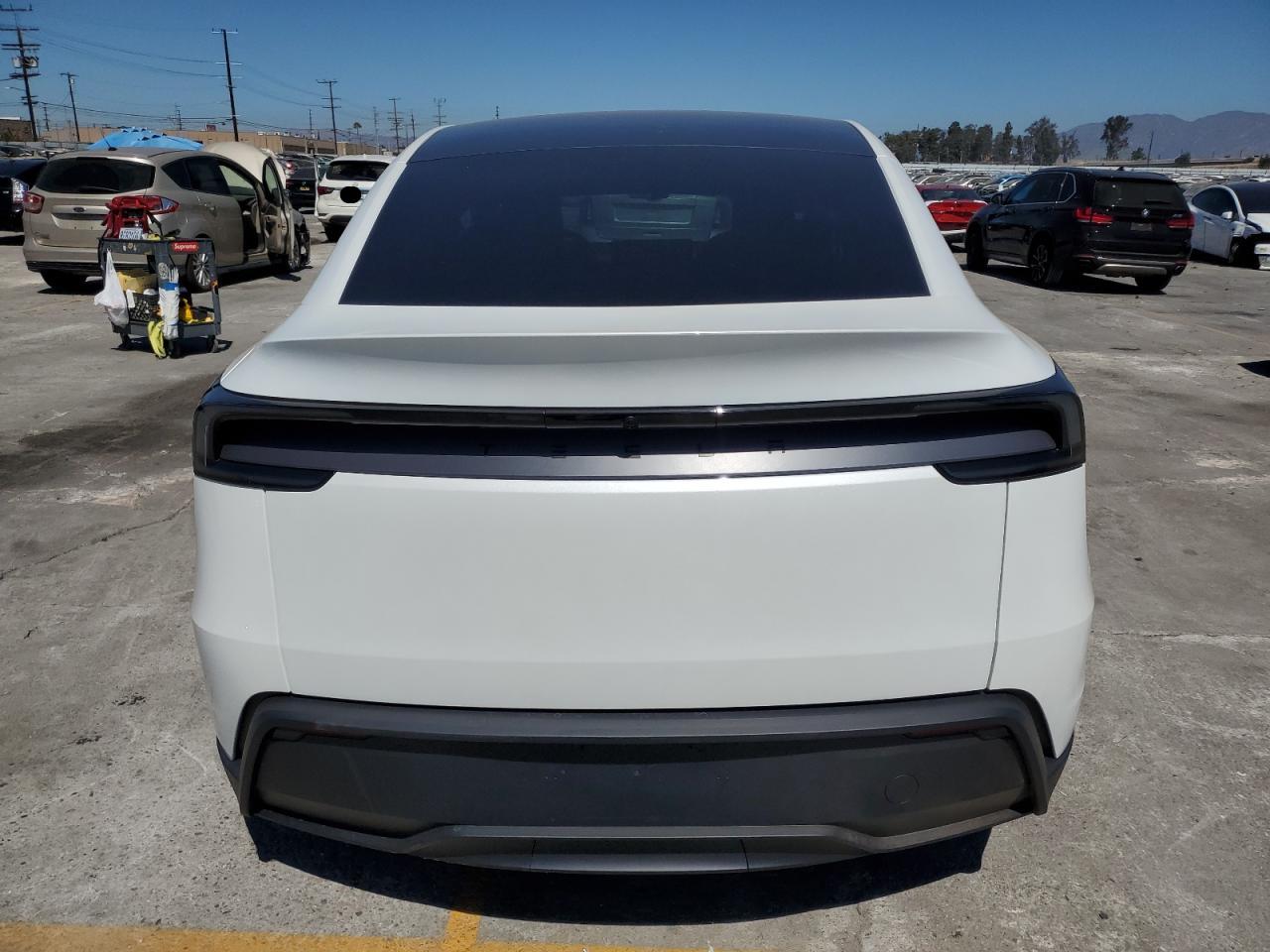 2026 Tesla Model Y VIN: 7SAYGDED3TF404582 Lot: 69503095