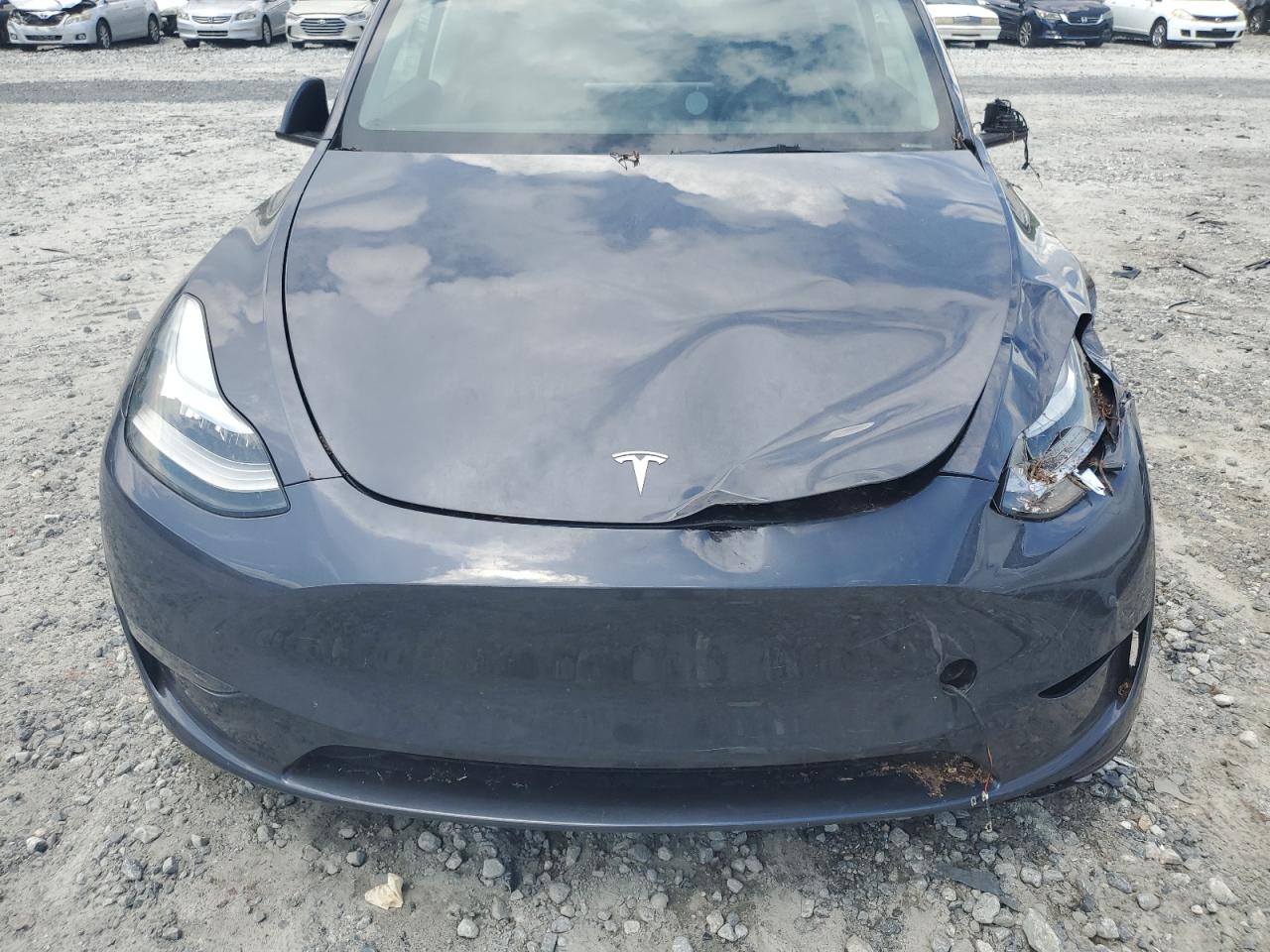 2023 Tesla Model Y VIN: 7SAYGDEE0PA155587 Lot: 67835905