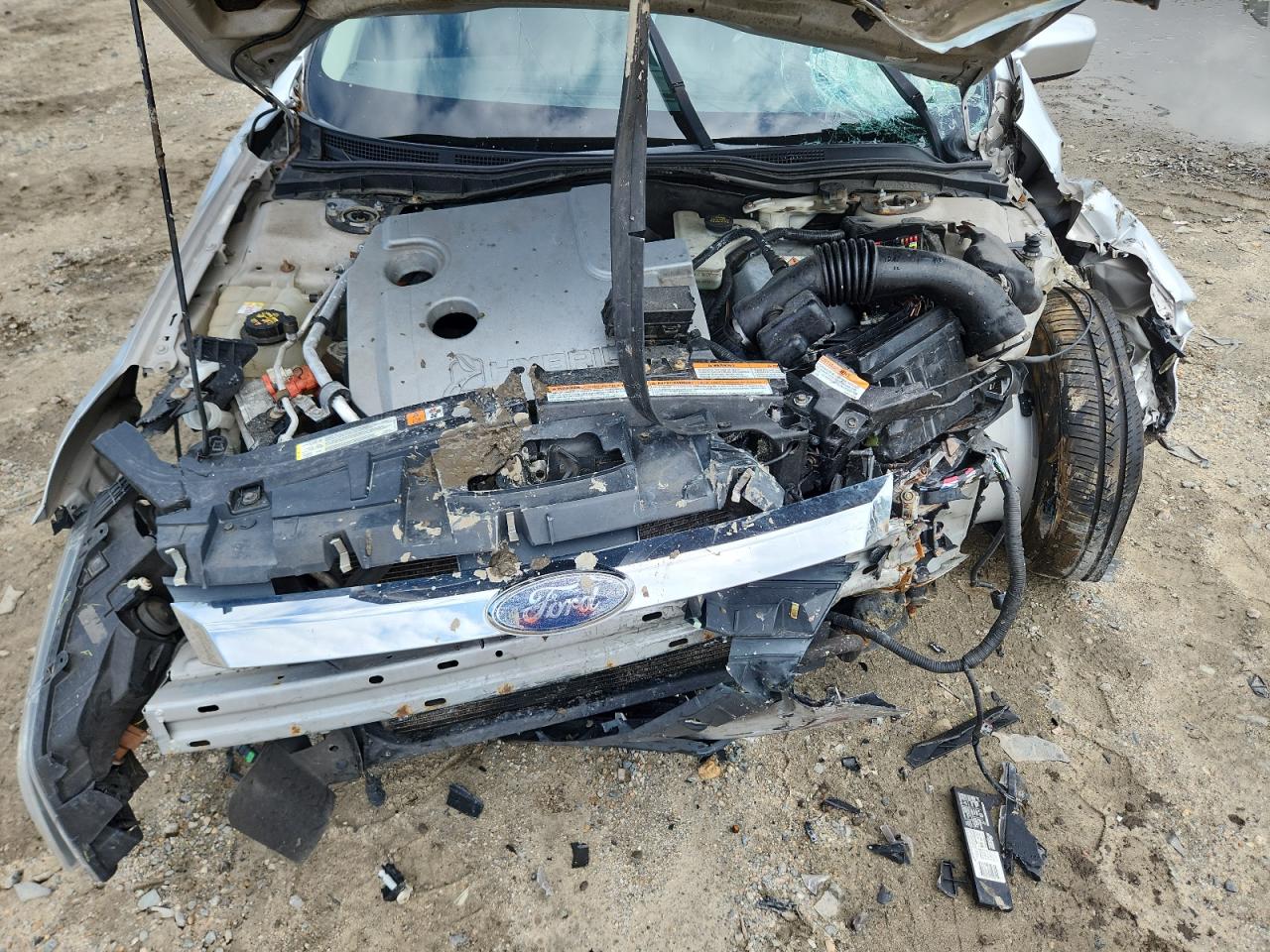 2010 Ford Fusion Hybrid VIN: 3FADP0L39AR230999 Lot: 69572015