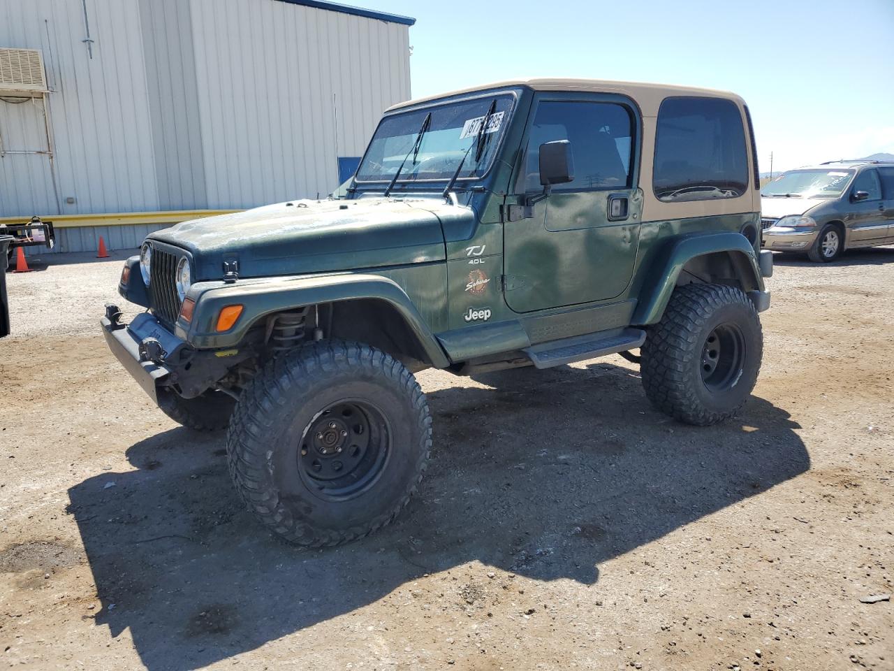 1997 Jeep Wrangler / Tj Sahara green null gas 1J4FY49SXVP455090 photo #1